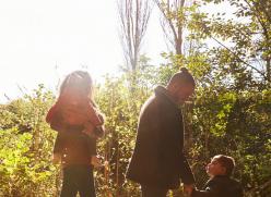 a family walking in a wood